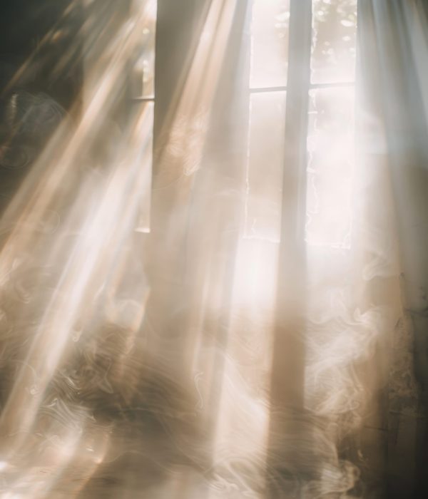 Sunlight Through Sheer Curtains Creating Rainbow Light Effects on Window.